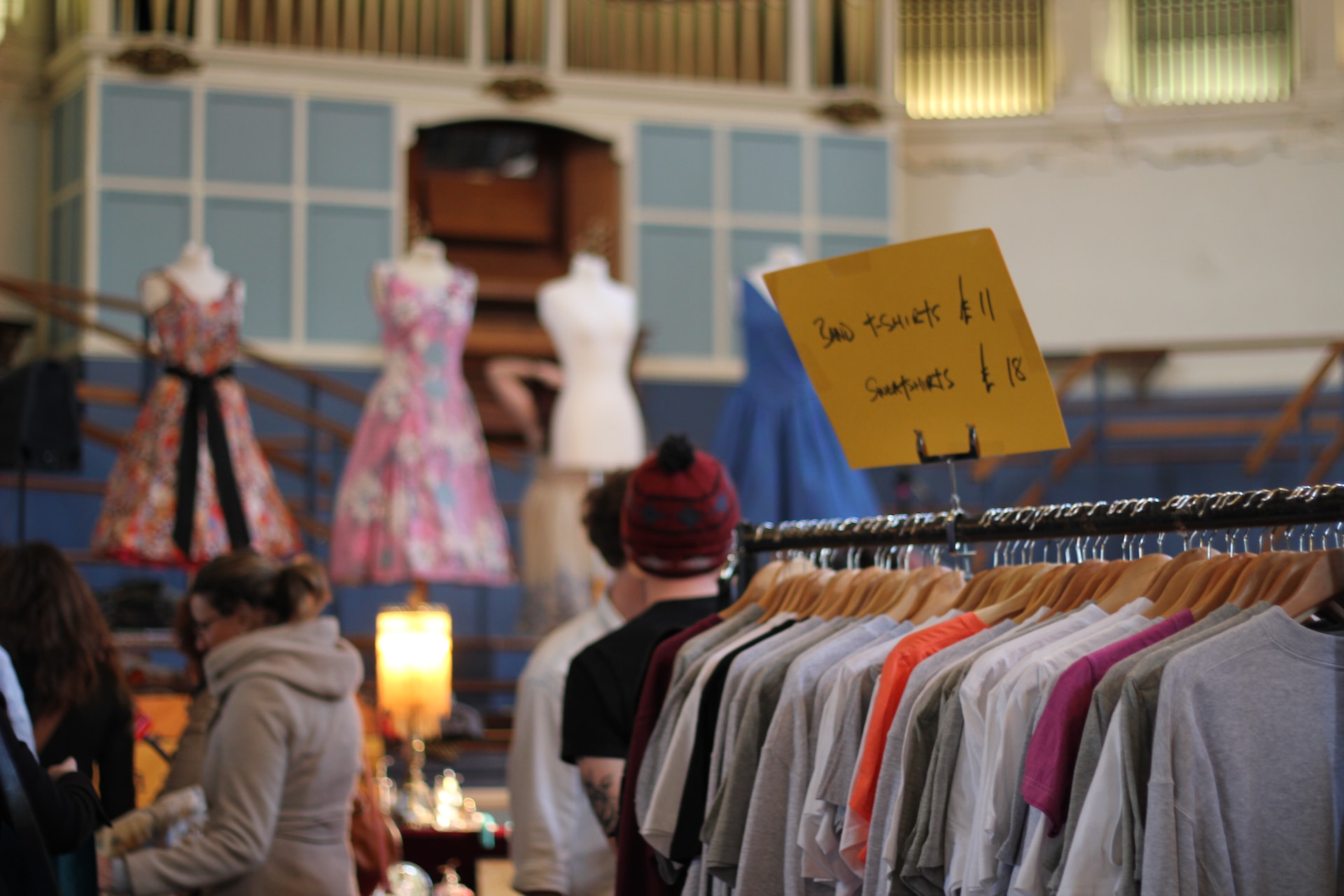 thrift store environment with shirts on a rack with a discounted price